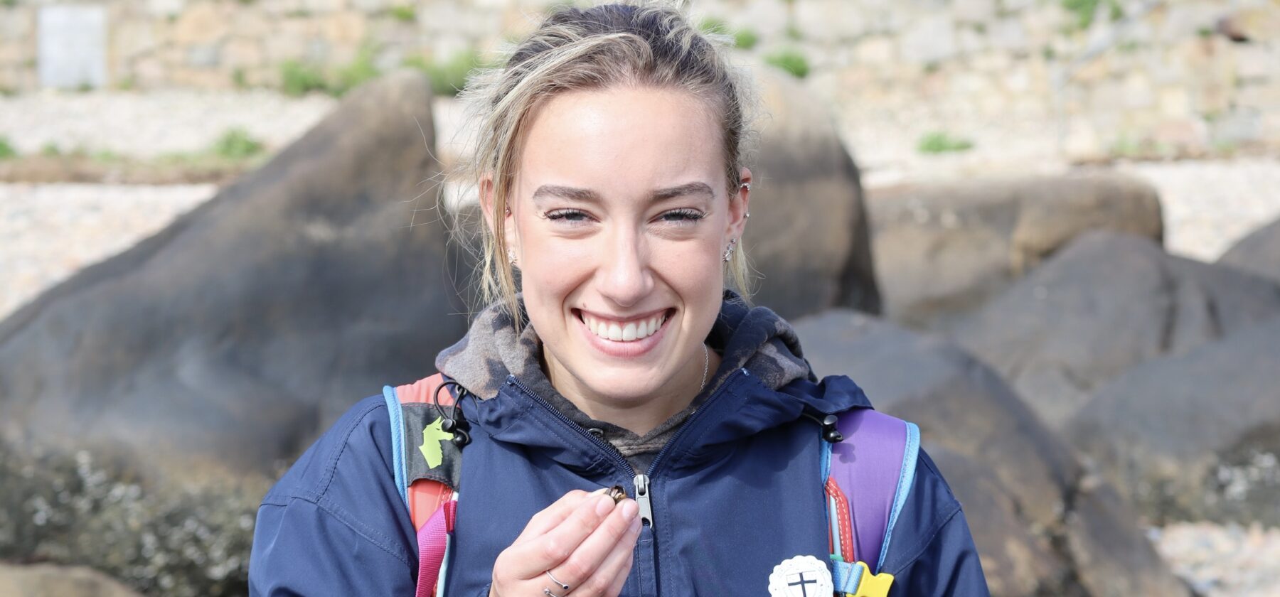 Allie Cook’ interns with penguins at the New England Aquarium.